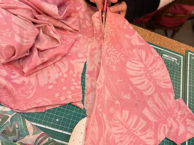 Cutting pink fabric