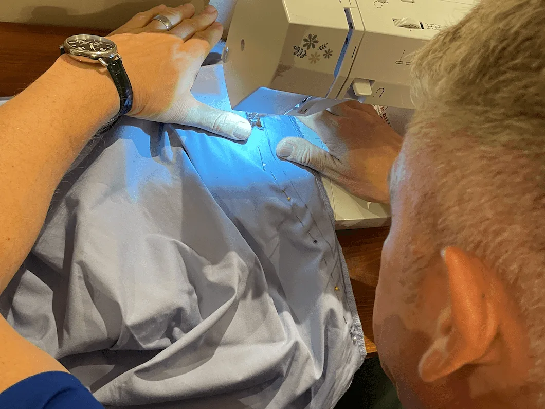 Man sewing on machine